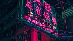 Bright Neon Lights Illuminating The Streets Of Japan Wallpaper