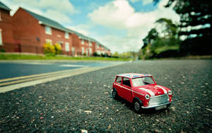 Bright Red Mini Cooper - Add A Little Spice To Your Ride Wallpaper