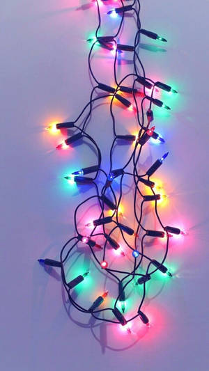 Brightly Lit Christmas Trees Sparkle During The Festive Holiday Season. Wallpaper