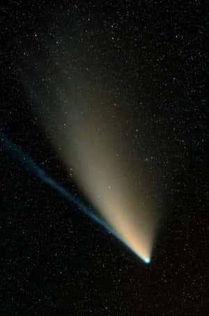 Brilliant Comet Shooting Across The Night Sky Wallpaper