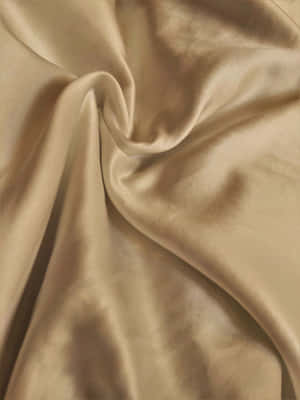 Bring A Touch Of Luxury To Your Home With This Golden Silk Wallpaper. Wallpaper