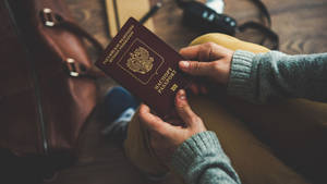 Brown Leather Bag And Russian Passport Wallpaper