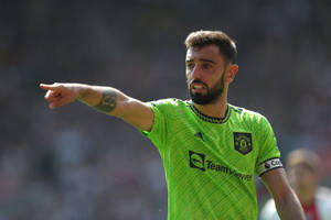 Bruno Fernandes Glowing In Neon Green Jersey Wallpaper