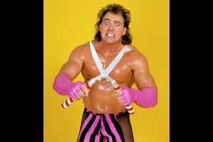 Brutus Beefcake Wrestler Posewith Shears Wallpaper