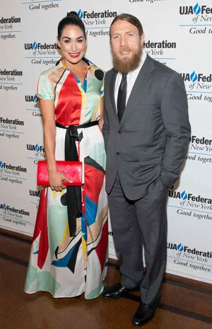 Bryan Danielson And Brie Bella Celebrating Their Love Wallpaper