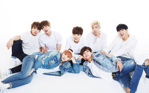 Bts Group Photo In Jeans Wallpaper