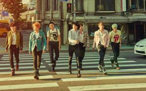 Bts Group Photo In Pedestrian Lane Wallpaper