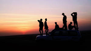 Bts Group Photo Sunset Wallpaper