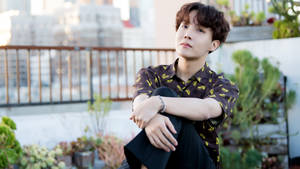 Bts J-hope Posing Outdoors Wallpaper