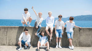 Bts Posing By Sea Wallpaper