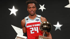 Buddy Hield With Trophy Portrait Wallpaper