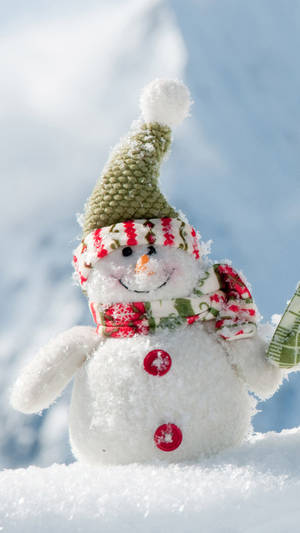 Bundle Up With Cozy Warmth With This Cute Winter Iphone Wallpaper! Wallpaper