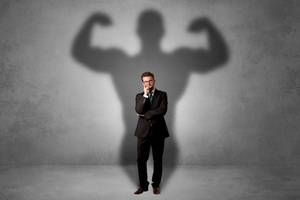 Businessman With Arrogant Shadow Wallpaper