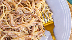 Cacio E Pepe Eaten With A Golden Fork Wallpaper