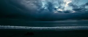 Calm But Cloudy Beach Oled Monitor Wallpaper