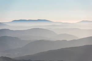 Calm Foggy Mountains Wallpaper