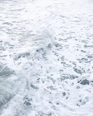 Calm Sea Along Shores Of White Wallpaper
