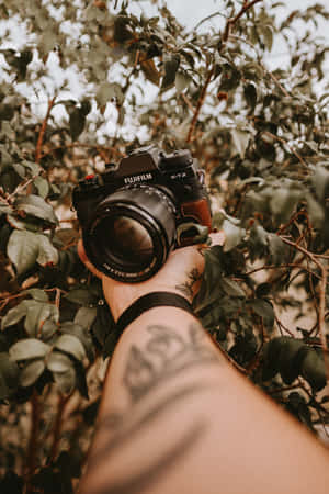 Camera And Hand Tattoo Photograph Wallpaper