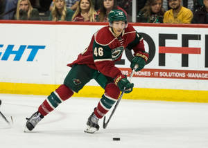 Canadian Hockey Player Jared Spurgeon In Action Wallpaper