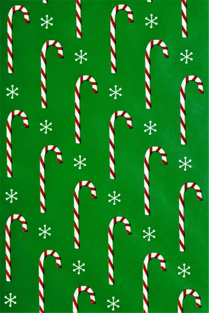 Candy Canes In Green Background Wallpaper