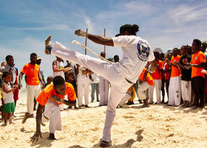 Capoeira Sparring At A Beach Wallpaper