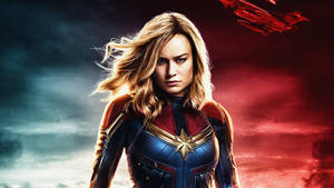 Captain Marvel Taking Flight On A Laptop Screen Wallpaper