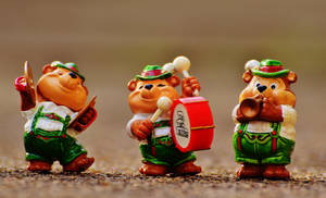 Caption: A Charming Troop Of Cute Bear Musician Figurines Wallpaper