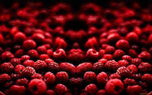 Caption: A Cluster Of Fresh Raspberries At Peak Ripeness Wallpaper