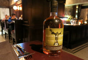 Caption: A Cosy Evening At Glendalough Irish Whiskey Bar And Restaurant Wallpaper