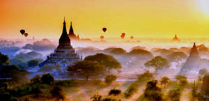 Caption: A Majestic View Of Yangon Ancient City At Dusk Wallpaper