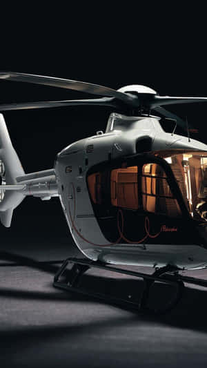 Caption: A Maverick Civil Helicopter In Flight Wallpaper