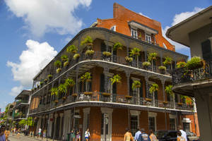 Caption: Aesthetic Charm Of French Quarter: A Close-up View Of A Famous House In New Orleans Wallpaper