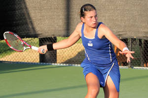 Caption: Anastasija Sevastova's In-action Capture While Waiting For The Ball In A Tennis Match Wallpaper