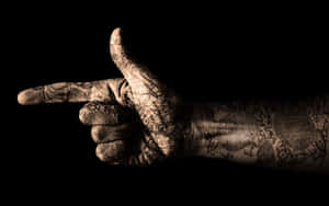 Caption: Artistic Pointing Finger Hand Tattoo Wallpaper