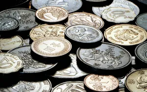Caption: Assortment Of Vintage International Coins Wallpaper
