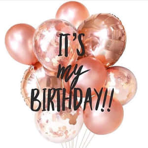 Caption: Celebrating Life With Rose Gold Birthday Balloons Wallpaper