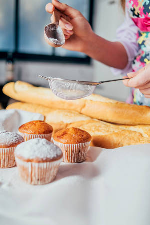 Caption: Deliciously Fresh-baked Muffin With Cake Dust Wallpaper