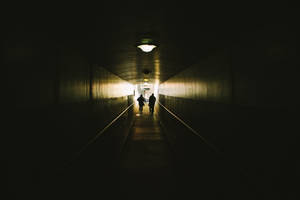 Caption: Embodying Pessimism Through A Dark Corridor Wallpaper