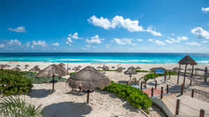 Caption: Enchanting Seaside View Of Cancun, Mexico Wallpaper