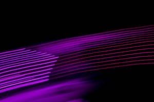 Caption: Enigmatic Black And Purple Light Streaks Wallpaper