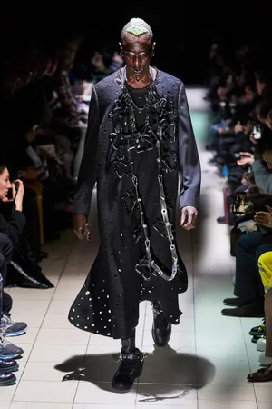 Caption: Exclusive Comme Des Garçons Chain Coat In High-res Wallpaper