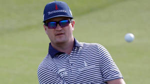 Caption: Famed Golfer Zach Johnson In Action Wallpaper