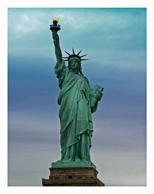 Caption: Freedom Beacon - The Majestic Statue Of Liberty Wallpaper