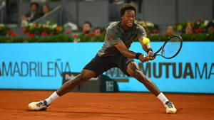 Caption: Gael Monfils In Action On Court Wallpaper