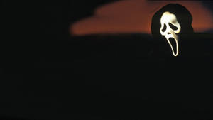 Caption: Ghostface From The Scream Franchise Wallpaper