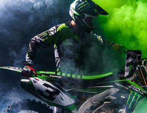 Caption: High-octane Adventure With Monster Energy Dirt Bike Wallpaper