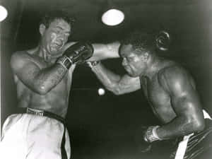 Caption: Joey Maxim Displaying Valor In The Ring Wallpaper