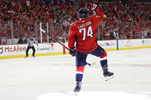 Caption: John Carlson Of Washington Capitals Celebrates Scoring A Goal Wallpaper