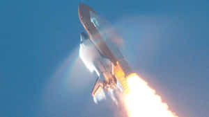 Caption: Majestic Space Shuttle In Flight Wallpaper