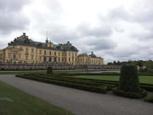 Caption: Majestic View Of Drottningholm Palace Wallpaper